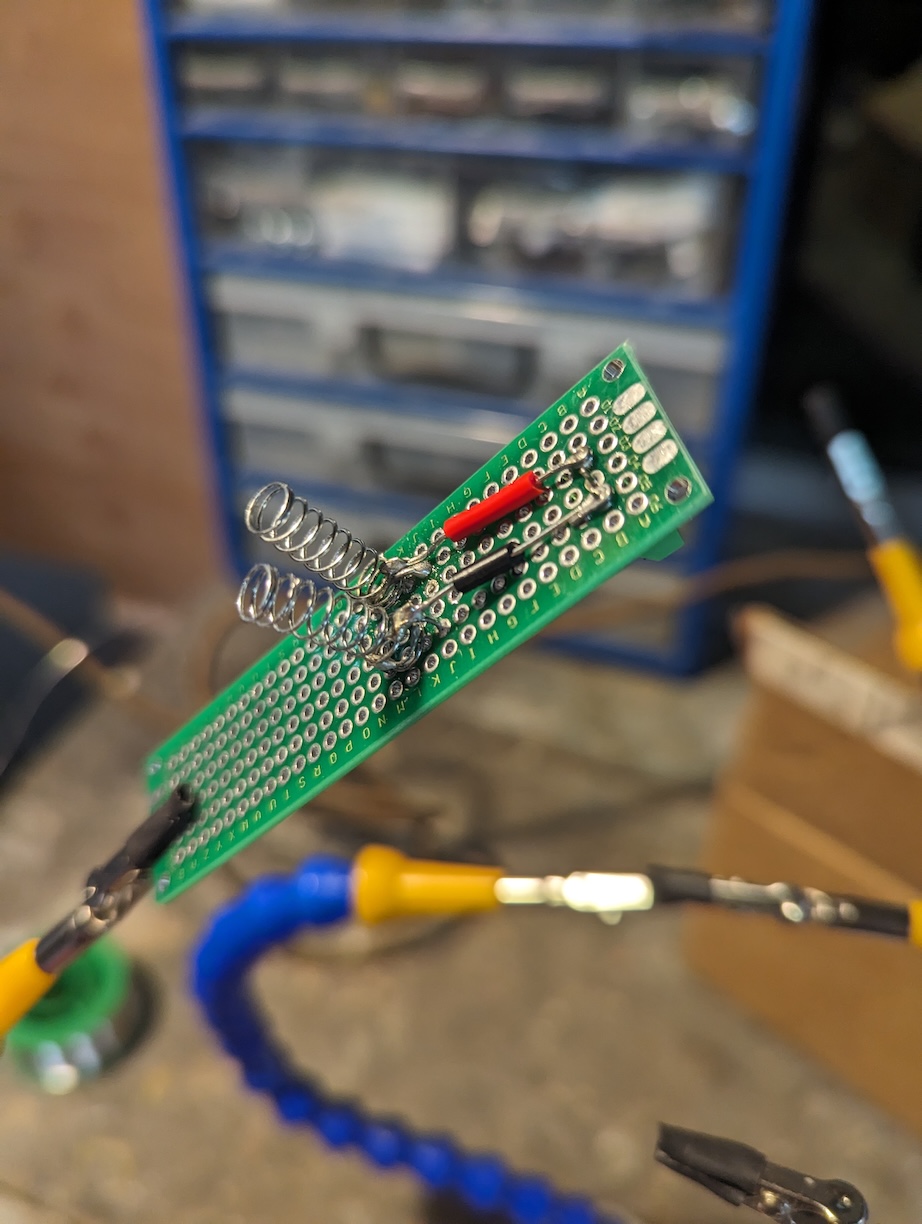 Pen springs soldered to perfboard